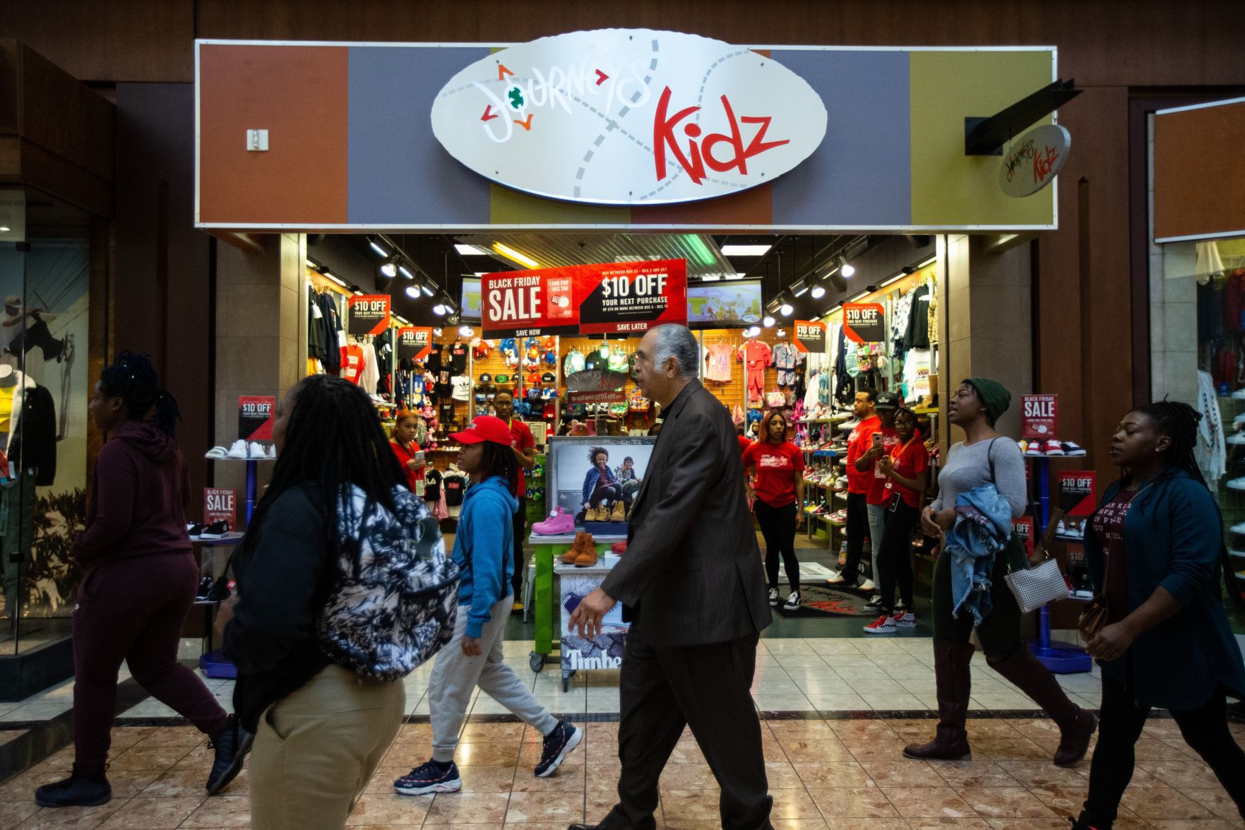 Protesters march in the St. Louis Galleria on Black Friday